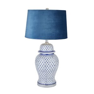 Stylish blue and white ceramic table lamp with a soft blue velvet shade for elegant decor