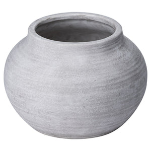 Harvey Bruce Darcy stone planter in a round shape with a textured gray finish for indoor or outdoor use