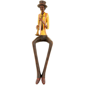 Sitting jazz band trumpeter figurine in colorful attire with a tall hat playing the trumpet