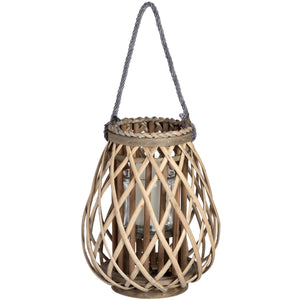 Small wicker lantern hanging with natural woven design and glass candle holder inside