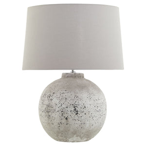 Harvey Bruce stone ceramic table lamp with a textured base and neutral fabric shade